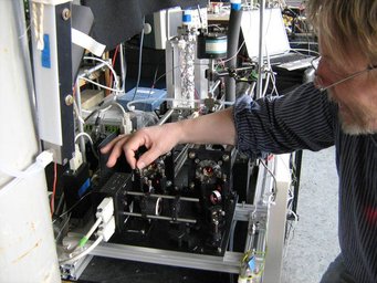 Person works on measuremnt instrument