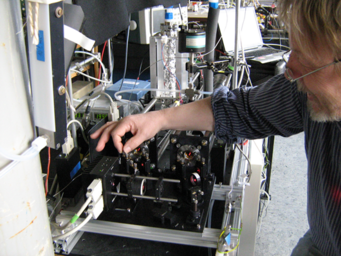 Person works on measurement instrument.