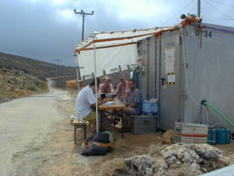 The group in front of the container The group in front of the container