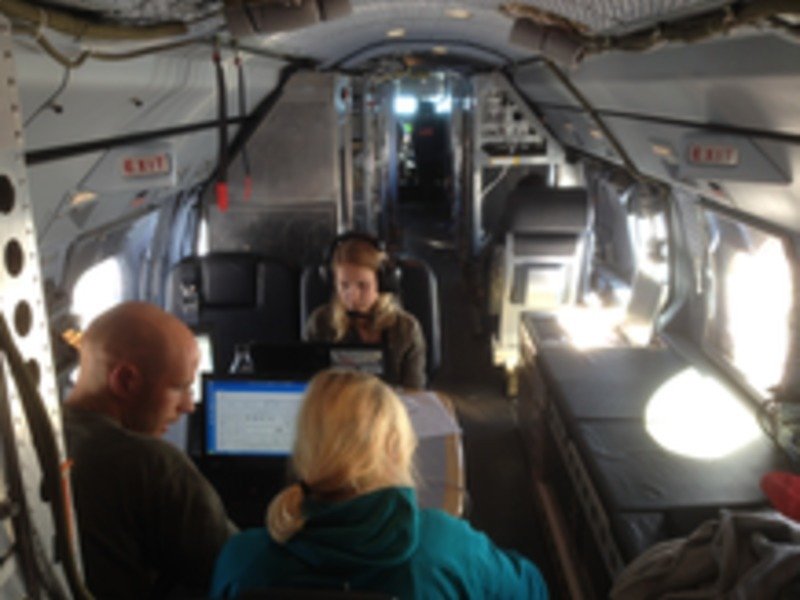 Inside view of the HALO research aircraft. The scientists busy at work tracking their measurements.