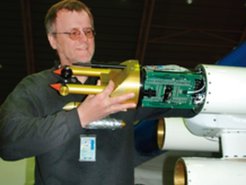 Prof. Dr. Stephan Borrmann mounting a laser optical cloud particle measurement device into the research aircraft Geophysica.