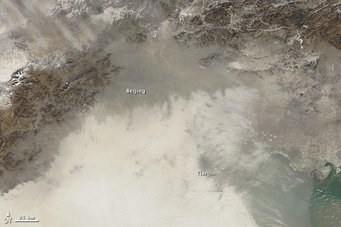 Organic particles are ubiquitous in air pollution. The new study reveals when and where these particles are liquid, viscous or solid. The picture shows an extreme haze event over Beijing and others cities in China in January 2013. Dense smog covering Beijing and Tianjin, obscuring city details from satellite perspective.