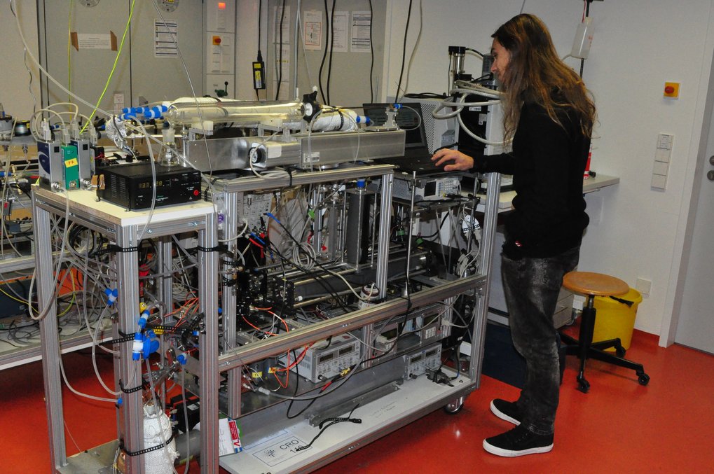 Person works on measurement instrument.