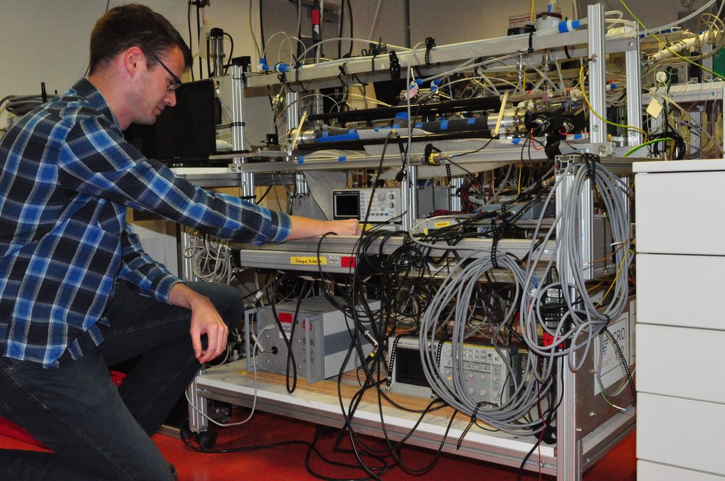 Person works on measurement instrument.