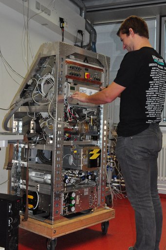 Person works on measurement instrument.