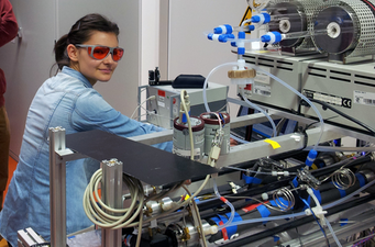 Person in the lab working on a machine.