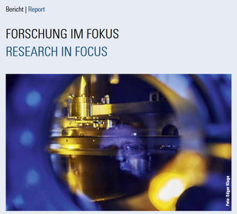 Front page newsletter. Close-up of scientific equipment with a metallic structure.