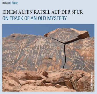 Newsletter front page 4/2017. Ancient petroglyphs on a rocky surface in a desert landscape.