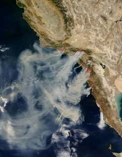 Satellite view showing smoke from fires stretching from California along the Pacific coast to northern Mexico.