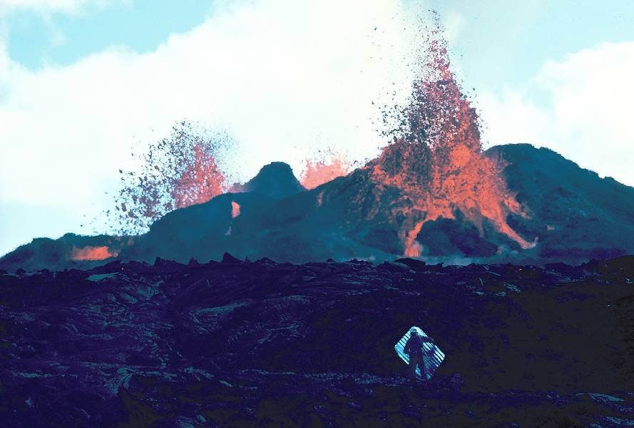 Erupting volcano with lava fountains and dark rocky foreground.