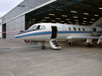The DLR research aircraft Falcon is pulled out of the hangar. Picture: J. Schneider, MPIC. The DLR research aircraft Falcon is pulled out of the hangar. Picture: J. Schneider, MPIC.