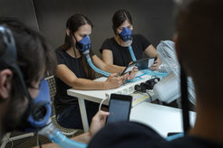 Study participants in a special controlled chamber located at the Technical University of Denmark. Occasionally they had to breathe into a special mask, which made it possible to measure the chemical composition of their breath and skin separately.