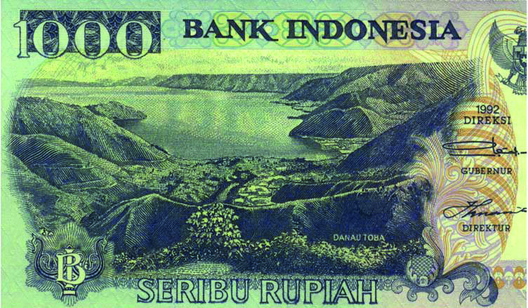 Banknote from Indonesia which shows the Lake Toba on North Sumatra, the lakefilled caldera left from the largest eruption of the past 100,000 years.
