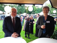 The Federal President Frank Walter Steinmeier talking with the developer of the Mainz window ventilation system Frank Helleis.