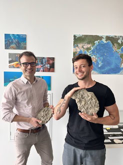 Alfredo Martínez-García (left) and Jonathan Jung (right) with Paleozoic coral samples